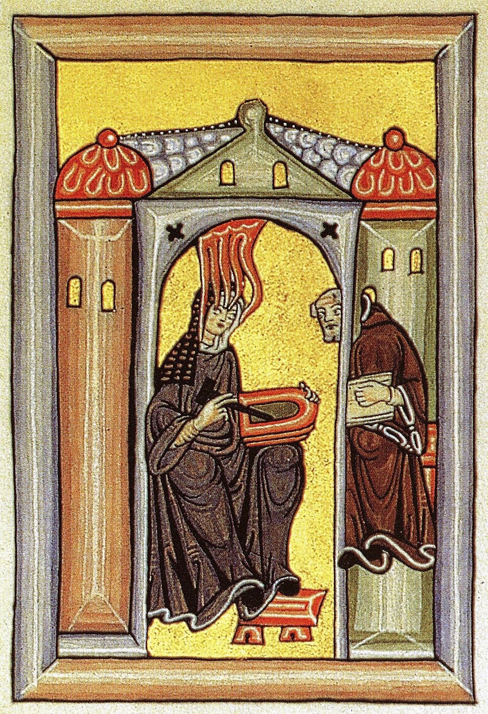 Medieval miniature: Hildegard seated under an arch, tongues of flame descending on her head, writing on a wax tablet while the monk Volmar looks in.
