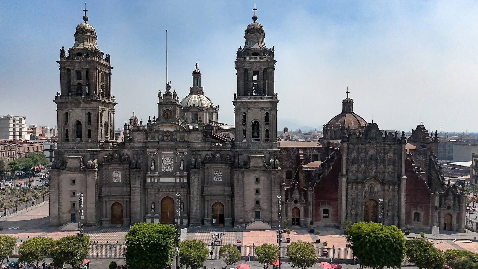 The Baroque façade, domes and twin bell towers of Mexico City Metropolitan Cathedral.